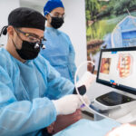 Dentist diagnosing a medical tourist in Jaco